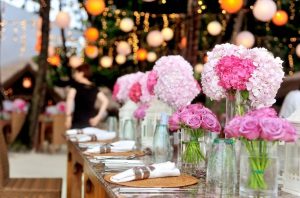 Close view of one side of a wedding reception table decorated wit pink flowers. | Wedding and event locations around Sherwood, AR.