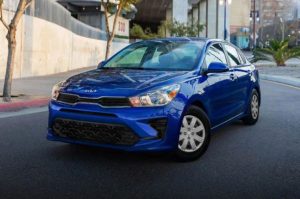 A blue 2022 Kia Rio parked on the street. | Kia dealer in Sherwood, AR.
