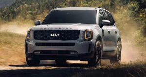 A silver 2022 Kia Telluride being driven on a dirt road. | Kia dealer in Sherwood, AR.