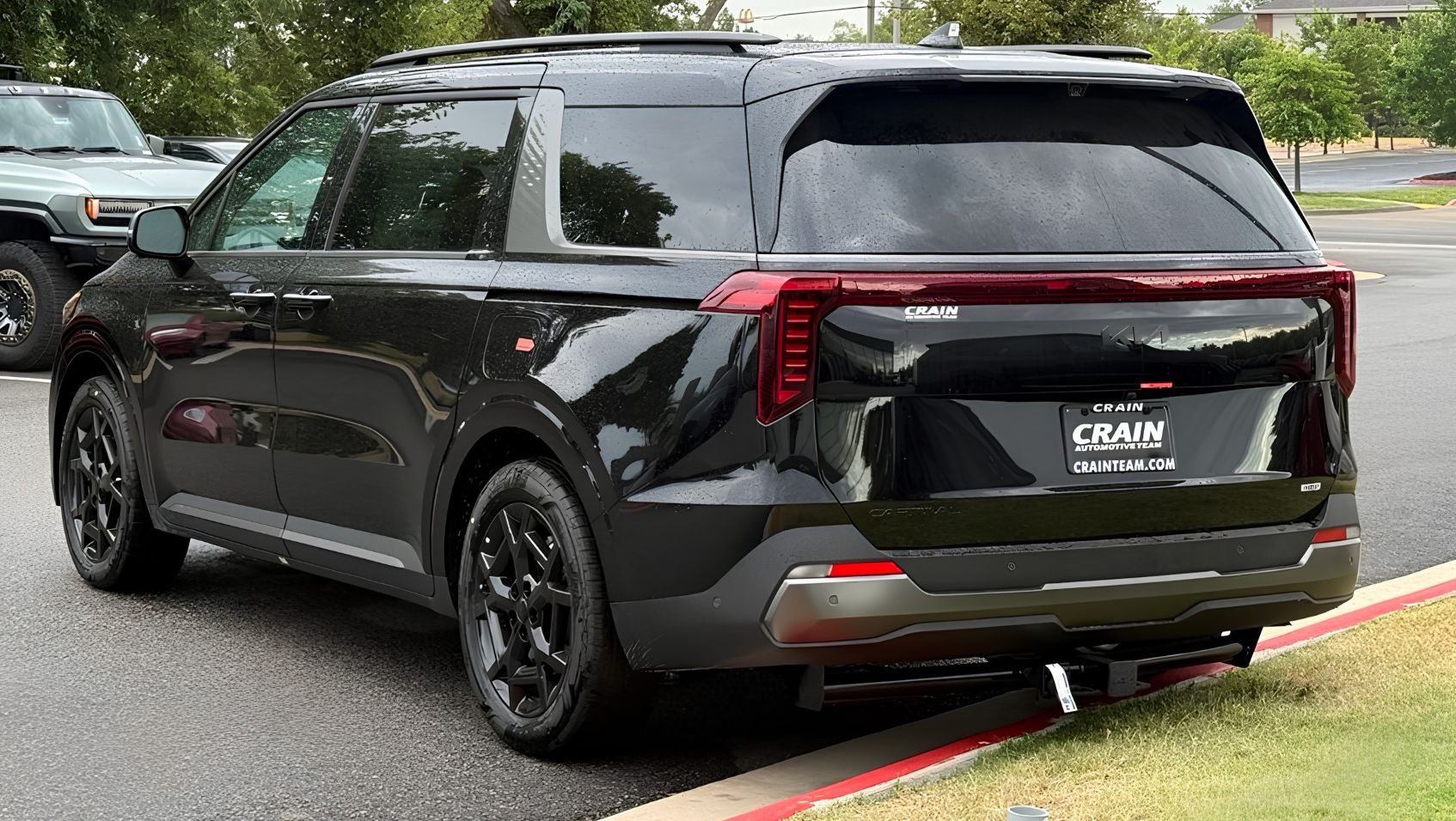 2027 Kia Carnival Hybrid rear at Crain Kia of Sherwood